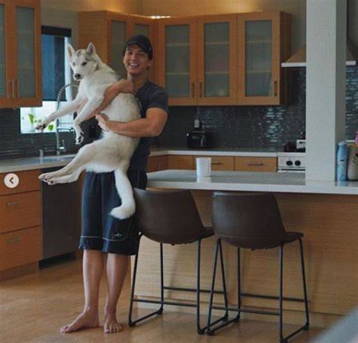 Aaron Burriss has a pet dog Guppy