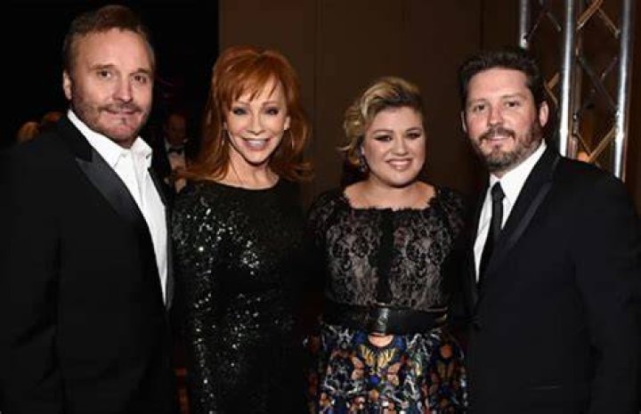 Brandon with his dad Narvel Blackstock, mom Reba McEntire, and ex-partner Kelly Clarkson