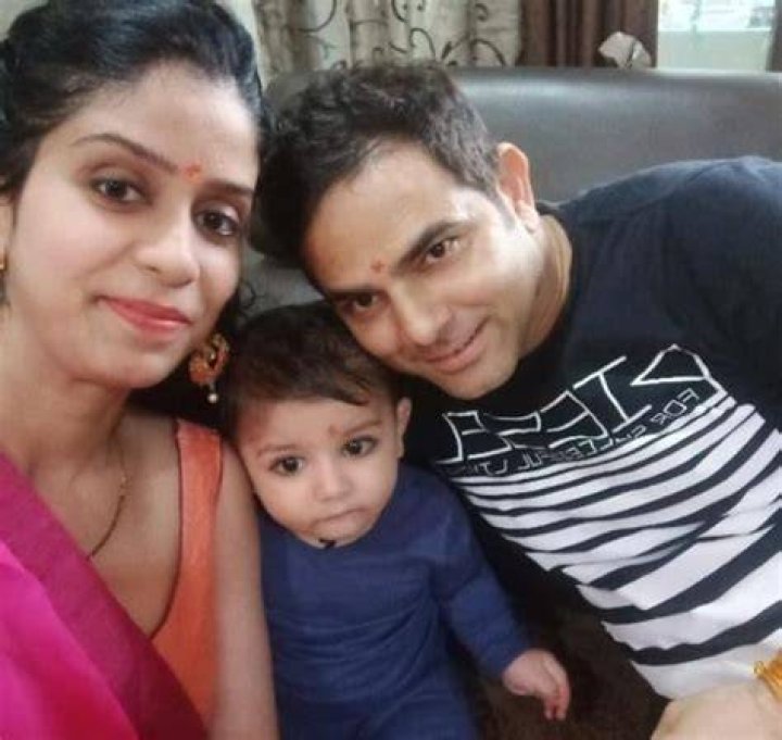 Deepesh Bhan with his spouse and son