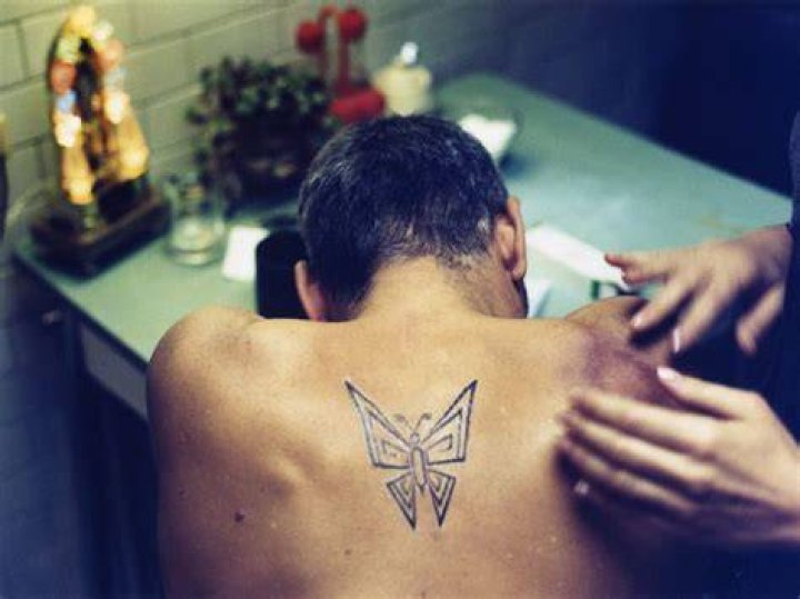 Does george clooney have a butterfly tattoo