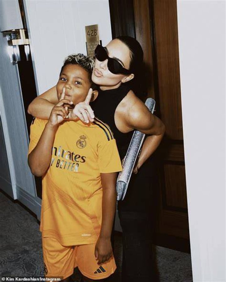 Saint with his mother Kim Kardashian, father Kanye West, and siblings
